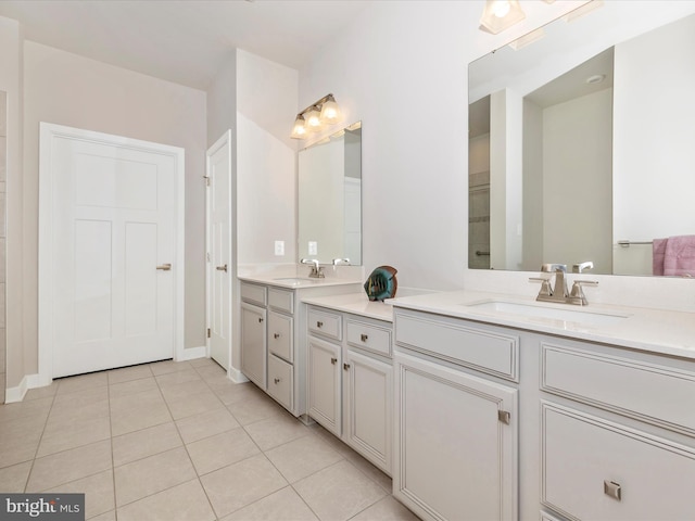 5303 Crape Myrtle Dr, Frederick, MD 21703 - bathroom with tile patterned flooring, double vanity, and baseboards
