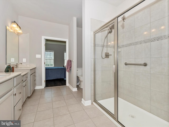 5303 Crape Myrtle Dr, Frederick, MD 21703 - bathroom featuring a shower stall, tile patterned floors, double vanity, ensuite bath, and toilet