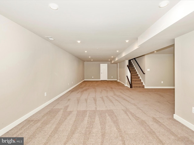 5303 Crape Myrtle Dr, Frederick, MD 21703 - finished below grade area with light carpet, stairway, baseboards, and recessed lighting