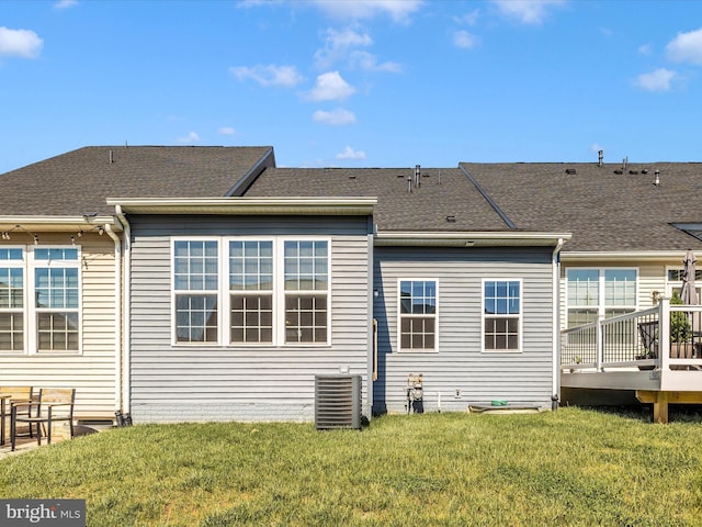 5303 Crape Myrtle Dr, Frederick, MD 21703 - back of house with cooling unit, a deck, a lawn, and roof with shingles