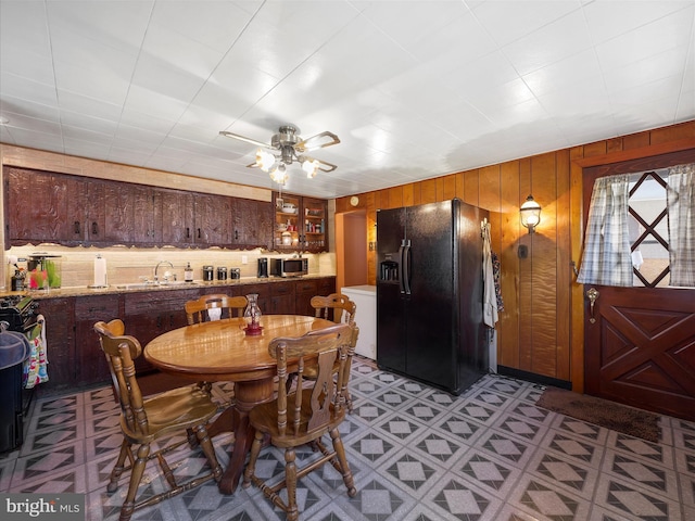 62 N 4th St, Chambersburg, PA 17201 - dining space with wood walls, light floors, and ceiling fan