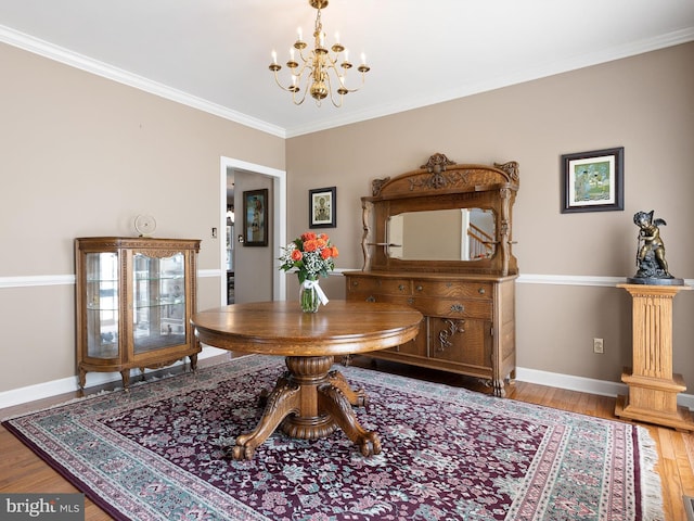 345 Jessica Dr, Middletown, DE 19709 - dining room with baseboards, ornamental molding, wood finished floors, and a notable chandelier