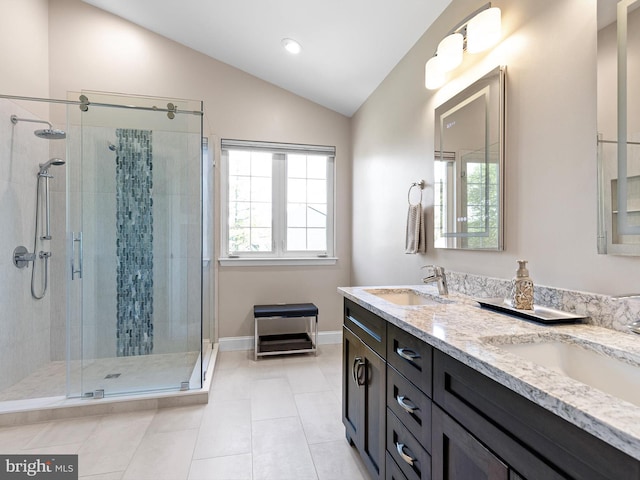 345 Jessica Dr, Middletown, DE 19709 - bathroom featuring a sink, a stall shower, double vanity, and lofted ceiling