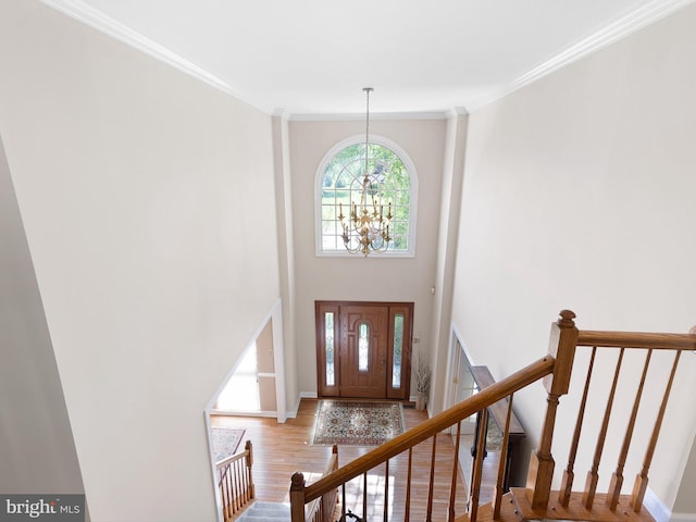 345 Jessica Dr, Middletown, DE 19709 - foyer featuring an inviting chandelier, ornamental molding, baseboards, and wood finished floors