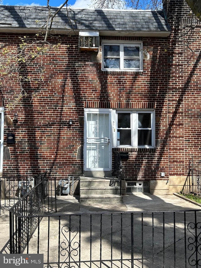 577 Snowden Rd, Upper Darby, PA 19082 - rear view of property with brick siding and a fenced front yard