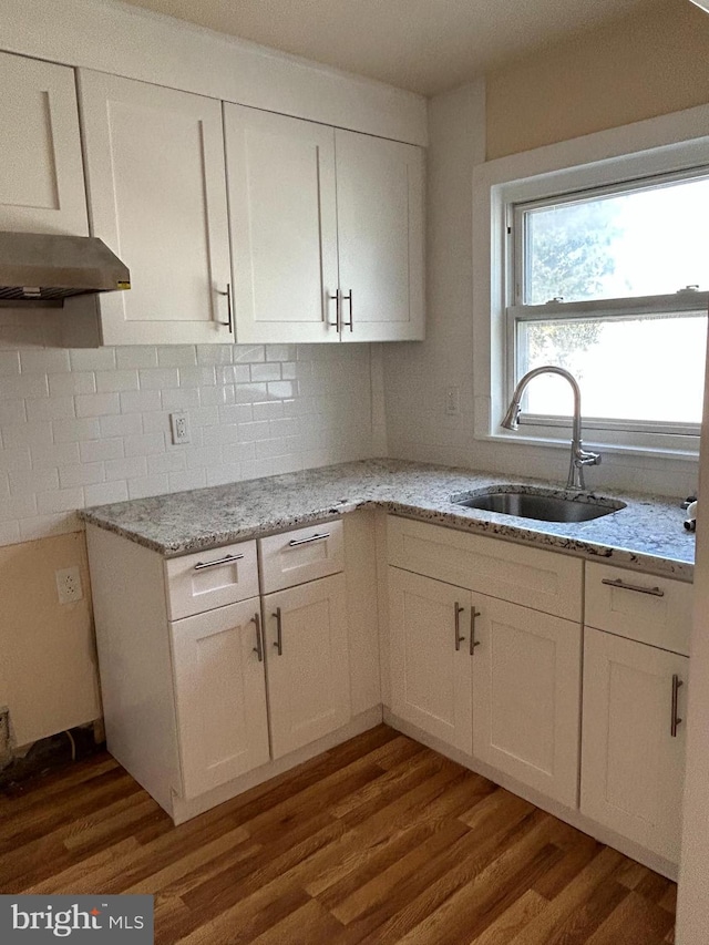 577 Snowden Rd, Upper Darby, PA 19082 - kitchen with a sink, light stone countertops, wood finished floors, and white cabinetry