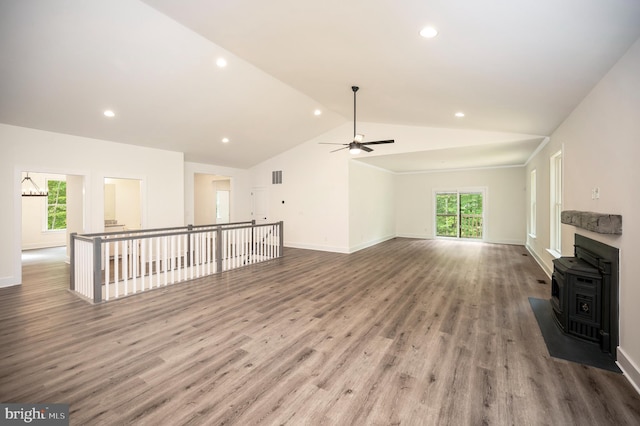9343 Troy Dr, Nokesville, VA 20181 - unfurnished living room with a ceiling fan, a wood stove, wood finished floors, lofted ceiling, and recessed lighting