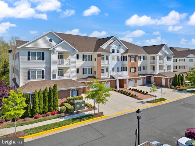 exterior space featuring a residential view, sidewalks, street lighting, and curbs