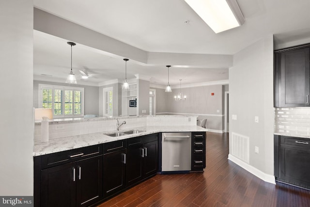 kitchen with visible vents, dark wood-style floors, tasteful backsplash, a sink, and dishwasher