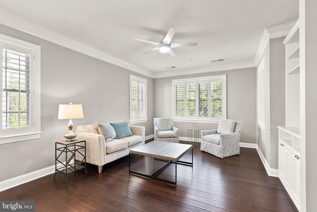 living room with dark wood-style flooring, ceiling fan, and ornamental molding