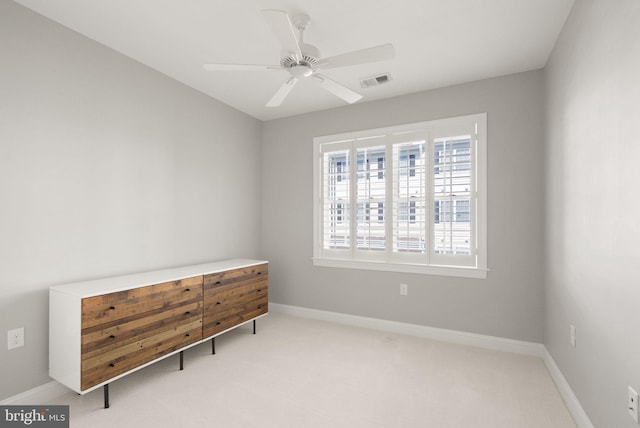 carpeted bedroom featuring a ceiling fan, baseboards, and visible vents