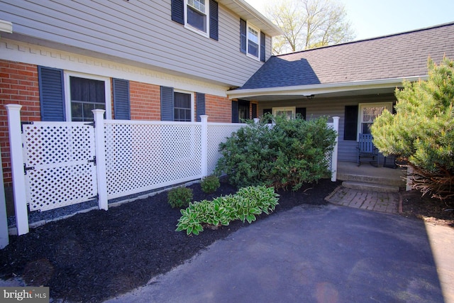 property entrance featuring brick siding