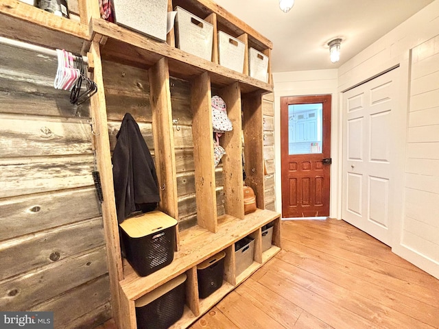 mudroom with light wood-style floors