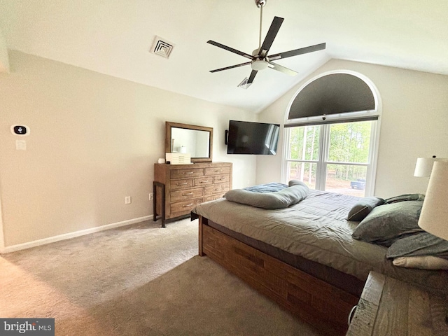 bedroom with carpet floors, lofted ceiling, baseboards, and a ceiling fan