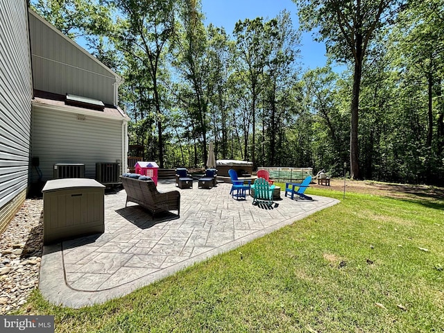view of patio / terrace featuring a fire pit and central AC
