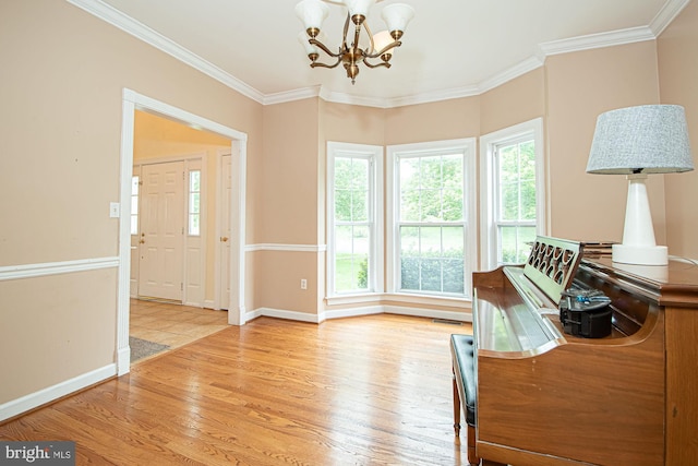 105 Fairfield Dr, Winchester, VA 22602 - doorway featuring a chandelier, crown molding, healthy amount of natural light, wood finished floors, and baseboards