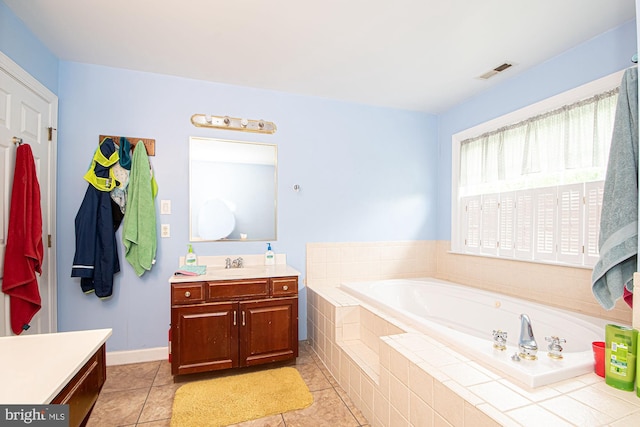 105 Fairfield Dr, Winchester, VA 22602 - bathroom with tile patterned floors, vanity, and a garden tub