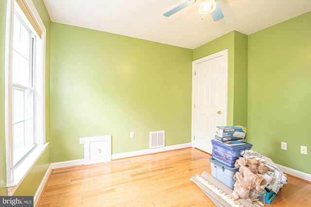 105 Fairfield Dr, Winchester, VA 22602 - unfurnished bedroom featuring multiple windows, wood finished floors, baseboards, and a ceiling fan