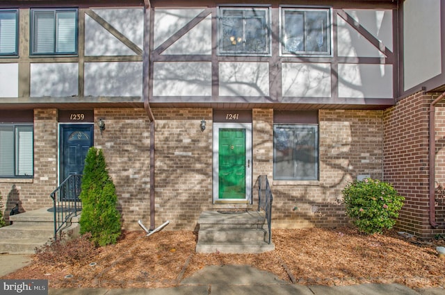 entrance to property with brick siding