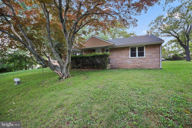 2115 Pennington, Ewing, NJ 08638 - view of front of house featuring stone siding, a front yard, and roof with shingles