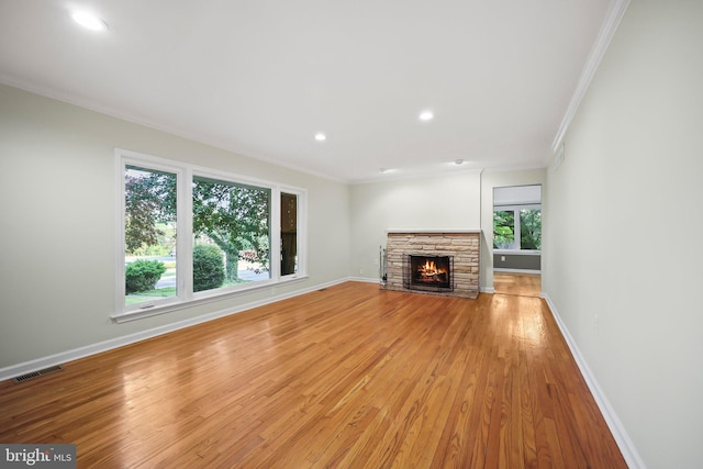 2115 Pennington, Ewing, NJ 08638 - unfurnished living room featuring crown molding, light wood-style floors, baseboards, a fireplace, and recessed lighting