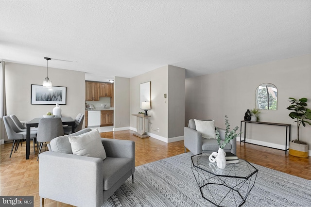1301 S Arlington Ridge Rd Unit 208, Arlington, VA 22202 - living area with a textured ceiling and baseboards