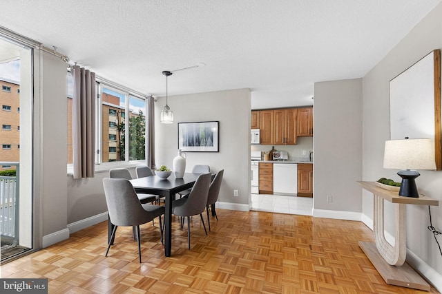 1301 S Arlington Ridge Rd Unit 208, Arlington, VA 22202 - dining room with baseboards and a textured ceiling