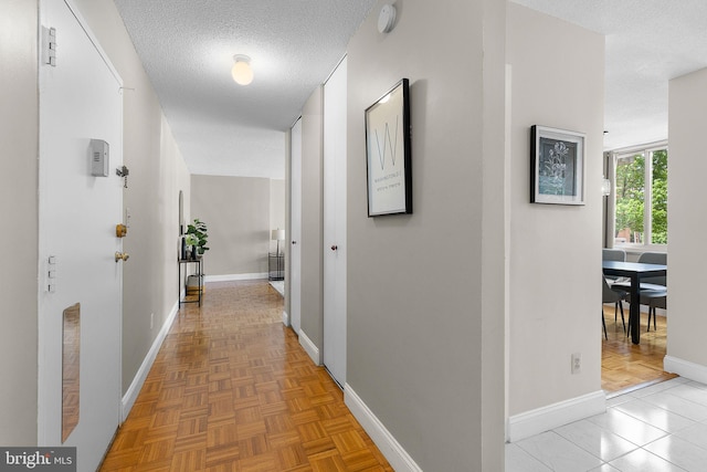 1301 S Arlington Ridge Rd Unit 208, Arlington, VA 22202 - hallway with a textured ceiling and baseboards