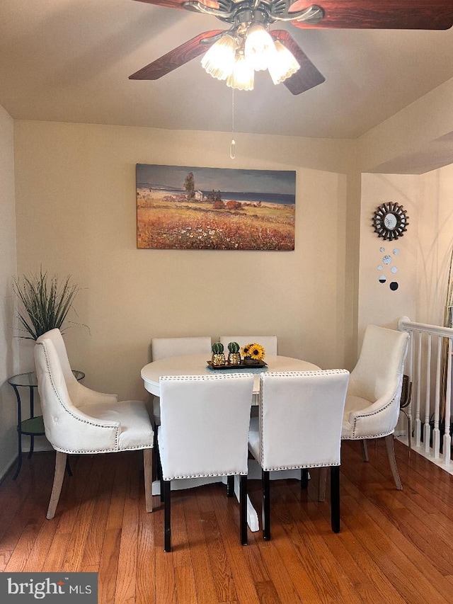 dining space featuring ceiling fan and wood finished floors