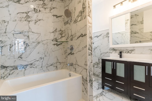 full bath with tile walls, vanity, bathtub / shower combination, and marble finish floor