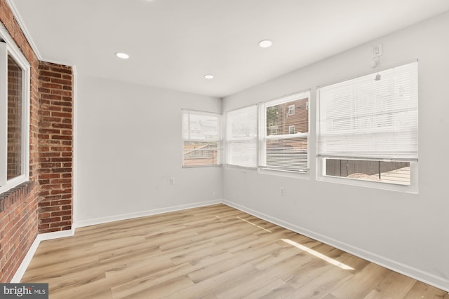 unfurnished room with baseboards, recessed lighting, and wood finished floors