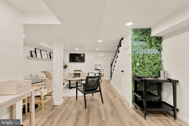 dining area featuring recessed lighting, baseboards, stairway, and light wood-type flooring