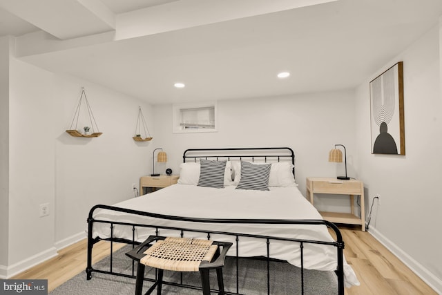 bedroom featuring baseboards, recessed lighting, and light wood-style flooring
