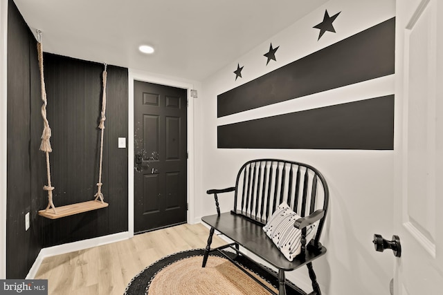 foyer entrance with recessed lighting, baseboards, and wood finished floors