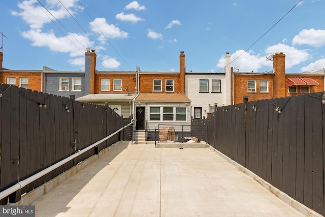 back of property featuring fence private yard