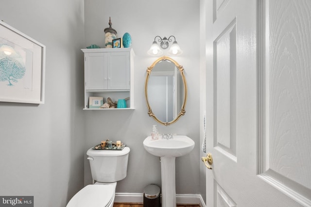 13073 Taverner Loop, Woodbridge, VA 22192 - bathroom with baseboards, a sink, and toilet