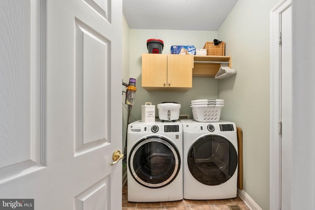 13073 Taverner Loop, Woodbridge, VA 22192 - clothes washing area featuring separate washer and dryer, baseboards, and cabinet space