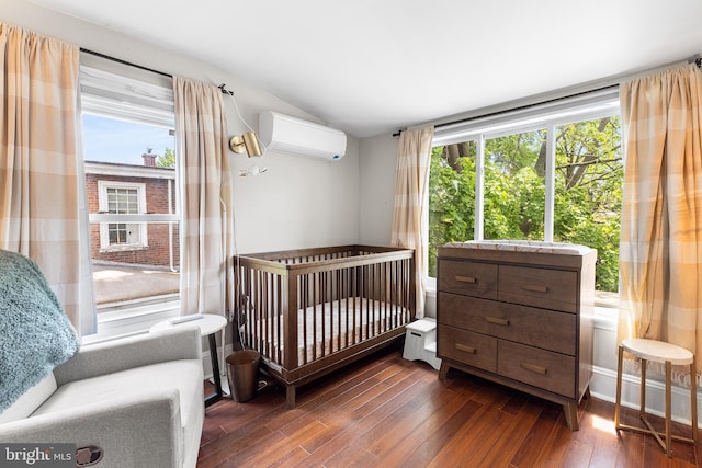 228 Morgan St, Phoenixville, PA 19460 - bedroom featuring a wall unit AC, dark wood-style floors, and vaulted ceiling