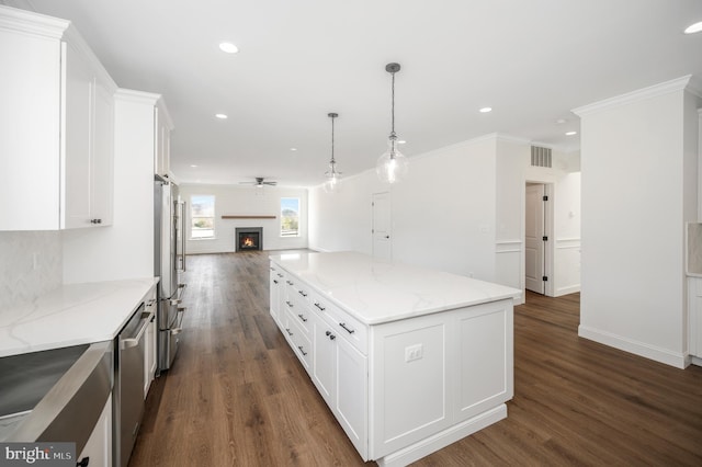 kitchen featuring a center island, stainless steel appliances, open floor plan, dark wood-type flooring, and visible vents