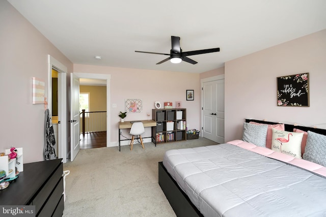 bedroom with carpet floors, baseboards, and a ceiling fan
