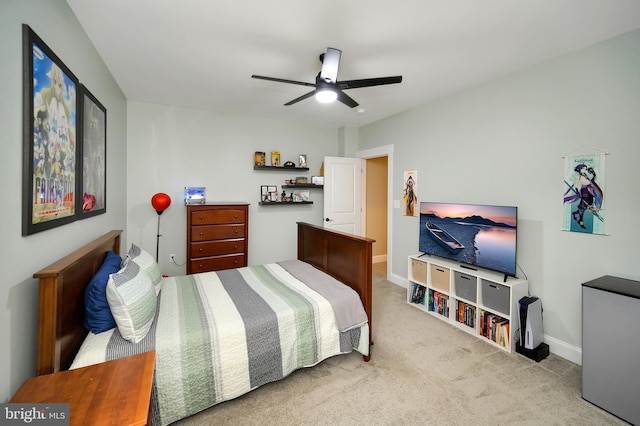 bedroom featuring baseboards, carpet flooring, and a ceiling fan
