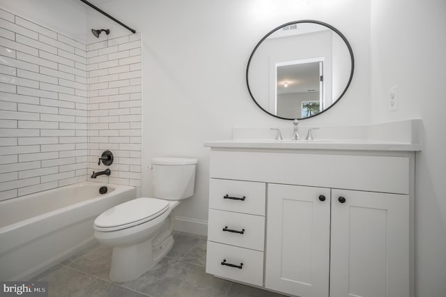 bathroom with vanity, toilet, baseboards, tile patterned floors, and  shower combination