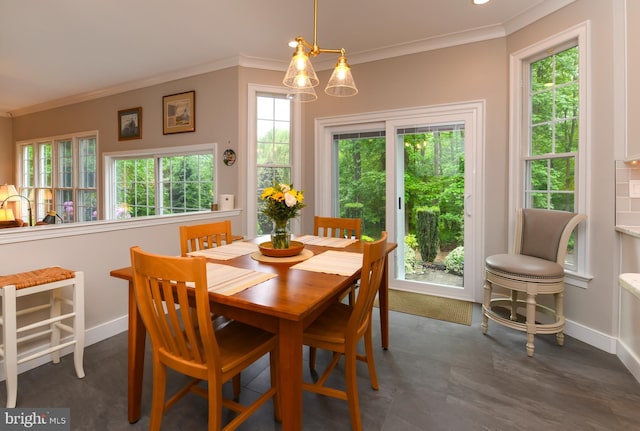 dining area with baseboards, ornamental molding, and plenty of natural light