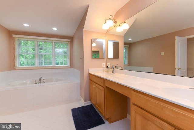 bathroom featuring tile patterned flooring, a garden tub, double vanity, recessed lighting, and baseboards