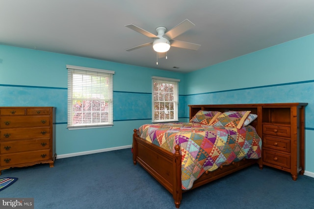 carpeted bedroom with baseboards and ceiling fan