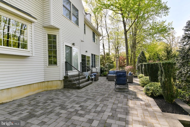 view of patio / terrace with entry steps and an outdoor living space