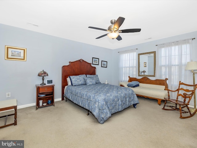 bedroom featuring carpet floors, baseboards, visible vents, and ceiling fan