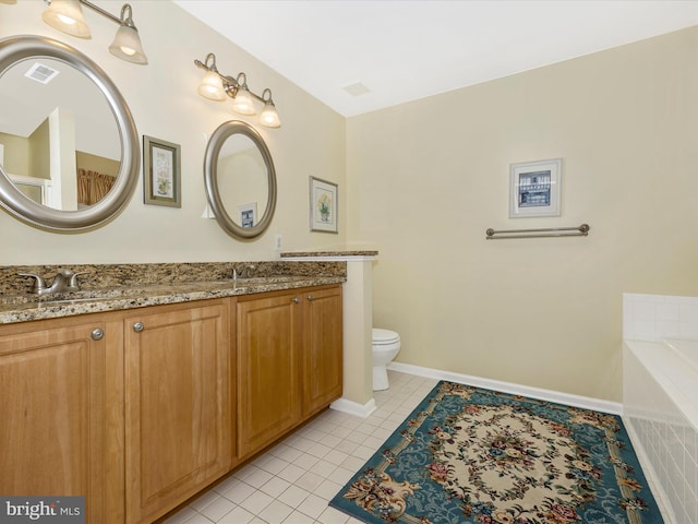 bathroom with a bathing tub, double vanity, tile patterned floors, and visible vents