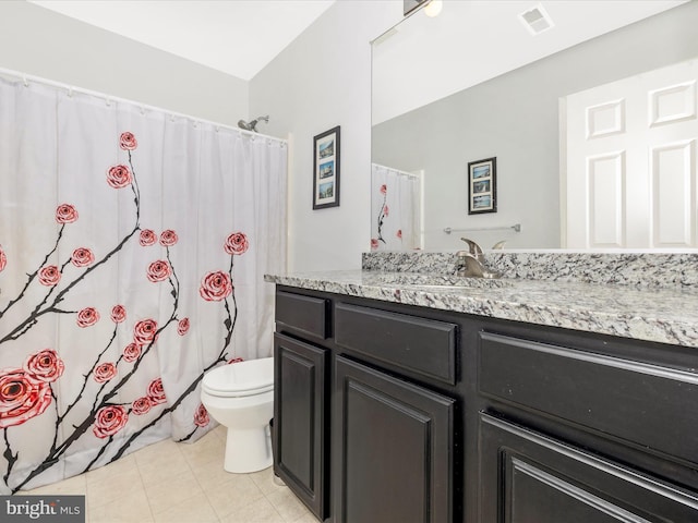 bathroom featuring visible vents, tile patterned flooring, curtained shower, vanity, and toilet