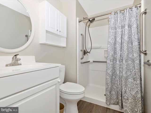 full bathroom with vanity, wood finished floors, and a shower with curtain